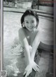 A black and white photo of a woman in a pool.